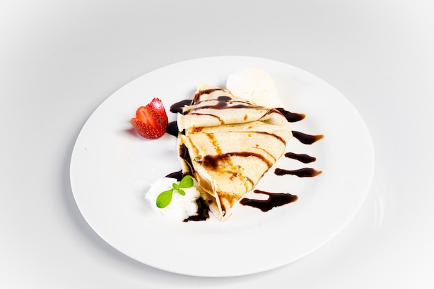 sweet crepe with ice cream stuffed with fruit