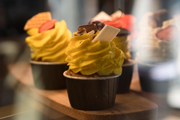 sweet cupcakes on display in a coffee shop or store