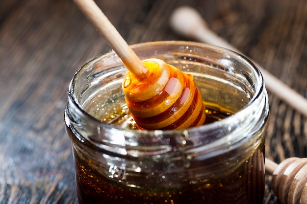 Sweet and delicious natural honey of a viscous consistency, food products created with the help of honeybee insects