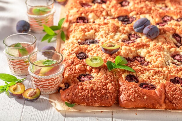 Sweet and delicious plum yeast cake served with lemonade