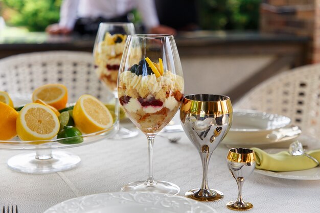 Sweet Dessert in big glasses on table served for wedding banquet