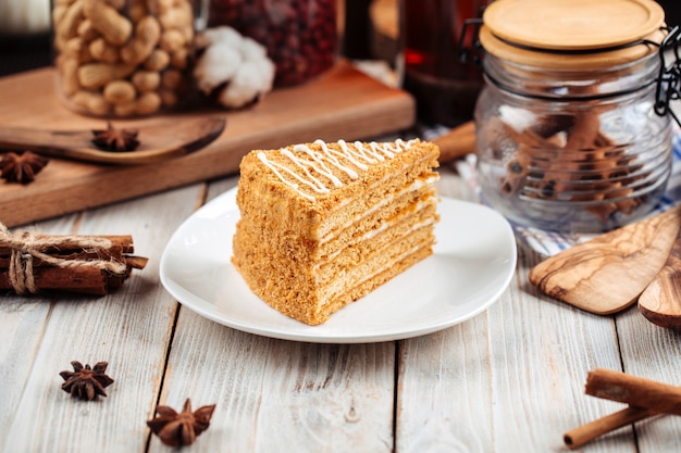 Sweet dessert slice of honey cake on a plate