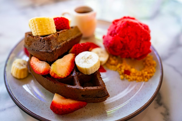 Sweet dessert with strawberries icecream and waffle