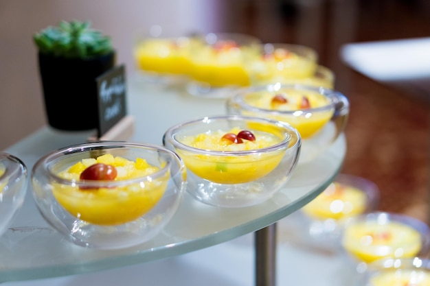 Sweet desserts in glassware and other sweets on the buffet table during the coffee break