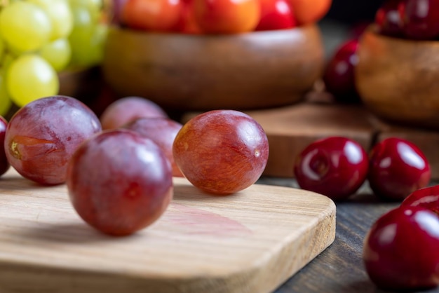 Sweet fresh cherries with other products cherries lying on the table