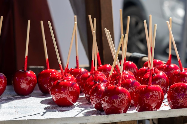 Sweet glazed red toffee candy apples on sticks