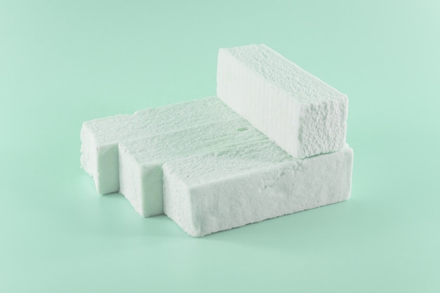 Sweet green marshmallow with mint flavor in the form of a geometric shape.