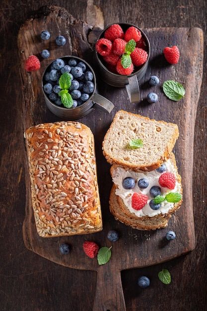 Sweet and homemade whole grain bread with blueberries and raspberries