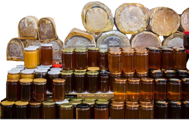 Sweet honey in a glass jar on white background Sweet honey product