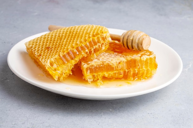 Sweet honeycomb isolated on white bee products with organic natural ingredients concept