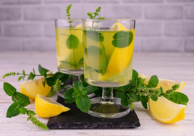 Sweet Italian lemon liqueur Limoncello with mint.