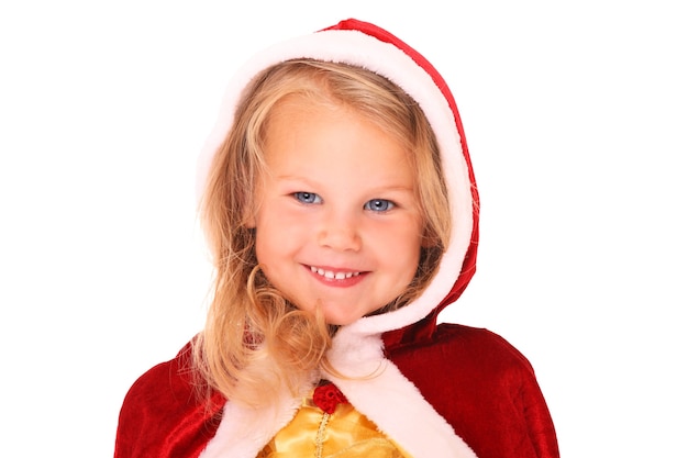 a sweet little girl in Santa's cape smiling over white