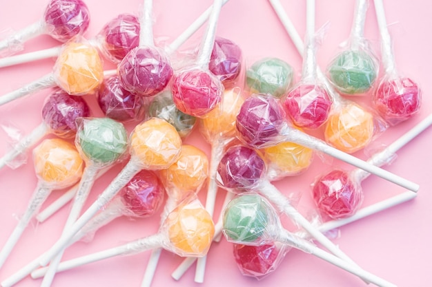 Sweet lollipops on pink background