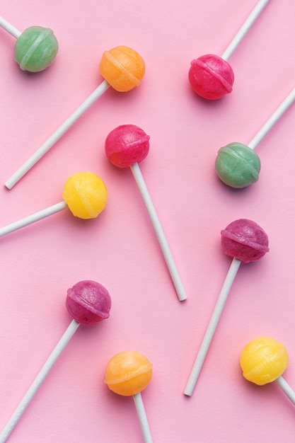 Sweet lollipops on pink background