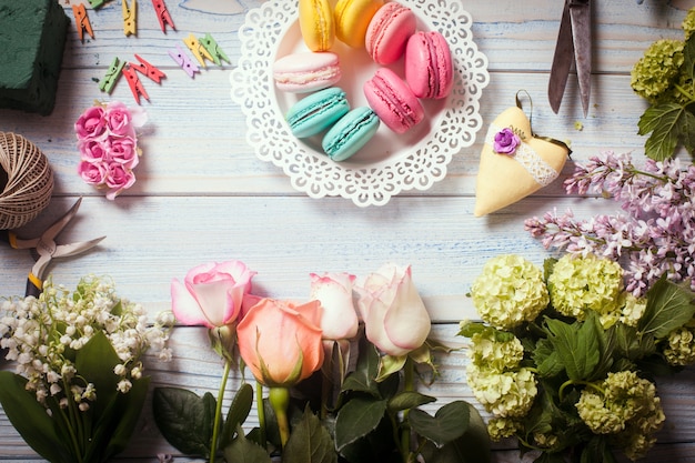 Sweet macarons and flowers - preparation of present