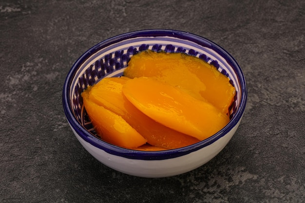 Sweet mango slices in syrop