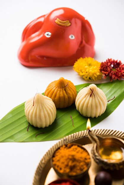 Sweet Modak food offered while Ganapati pooja or Ganesh puja