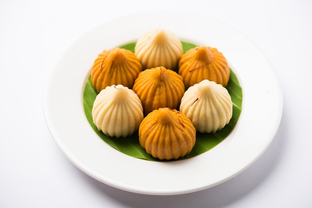 Sweet Modak food offered while Ganapati pooja or Ganesh puja