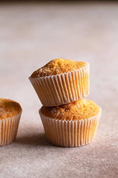 Sweet muffins with powdered sugar Homemade bakery Muffins in capsules