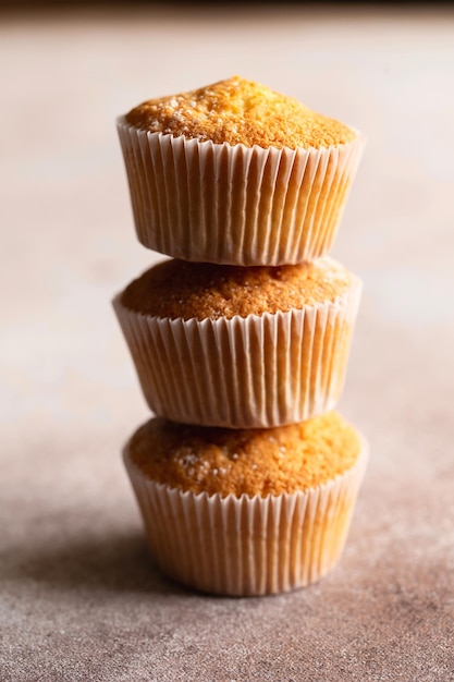 Sweet muffins with powdered sugar Homemade bakery Muffins in capsules