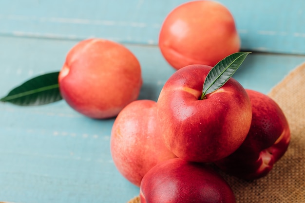 Sweet nectarine on wooden background