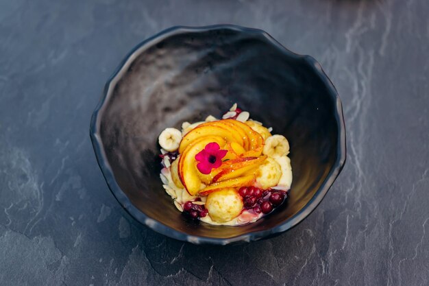 Sweet oatmeal with fried cheese balls peach and cranberries Healthy breakfast