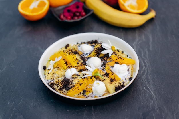 Sweet pancakes with ice cream chocolate and orange served on white plate Healthy and tasty breakfast