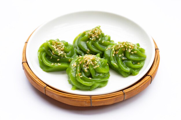 Sweet pandan pudding with white sesame seeds