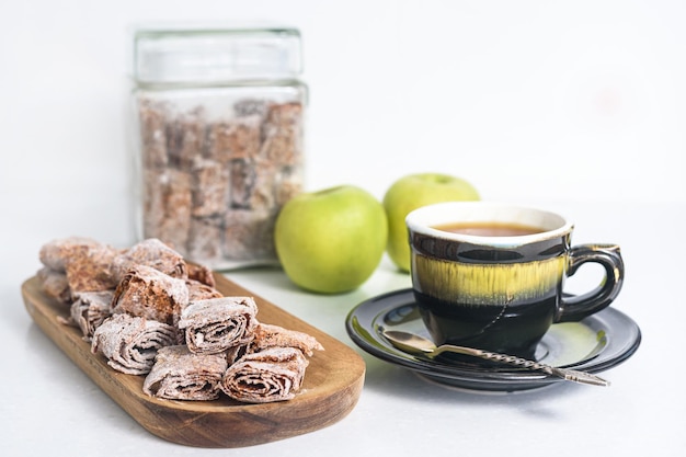 Sweet pastille of apples in rolls with tea