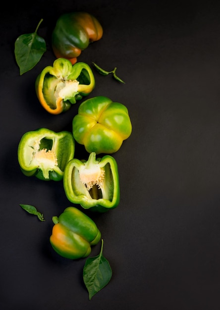 Sweet pepper green bell pepper on black background full depth of field