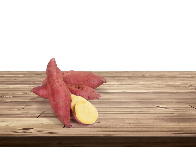 Photo sweet potato on wooden table isolated on white background