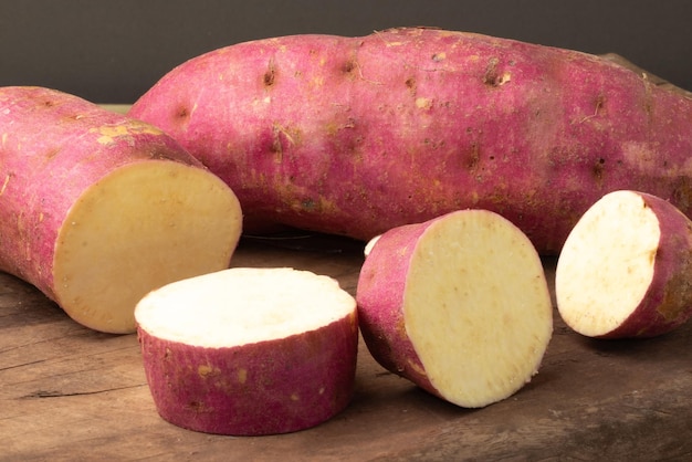 Sweet potatoes on cutting board close up