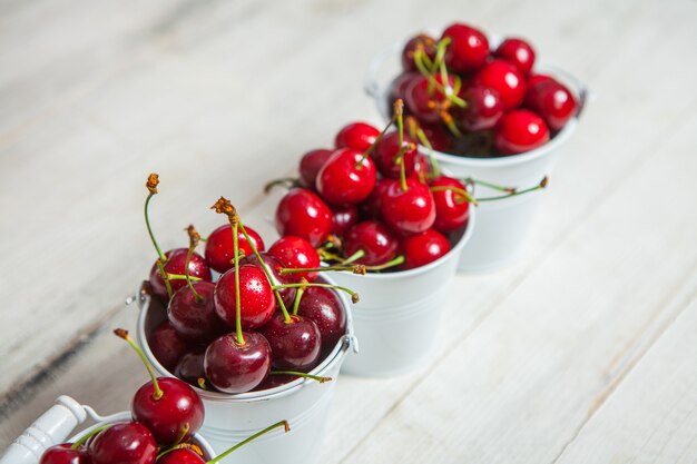 Sweet red cherries isolated on white surface