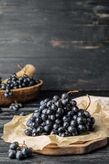 Sweet ripe grapes on table