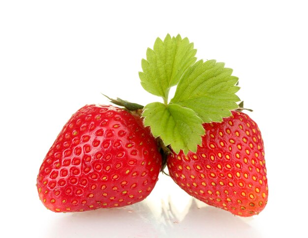 Sweet ripe strawberries with leaves isolated on white