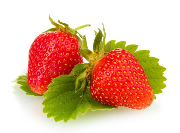 Sweet ripe strawberries with leaves isolated on white