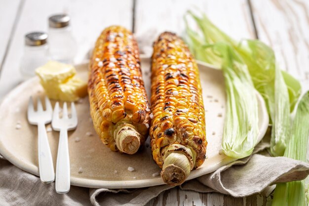 Sweet and salty grilled corn cob with melting butter