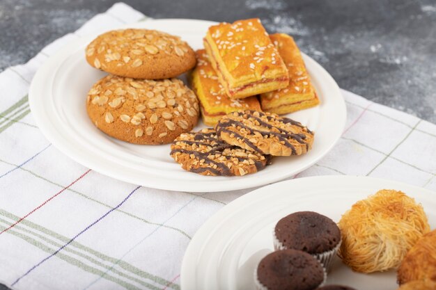 Sweet snacks placed on a stone table .