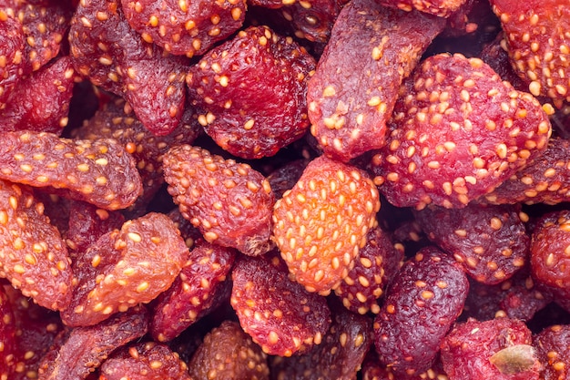 A sweet soft red fruit with a seed-studded surface