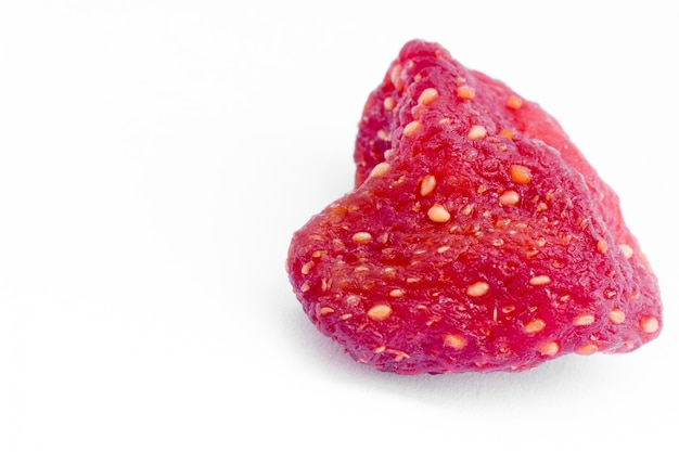 A sweet soft red fruit with a seed-studded surface