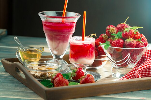 Sweet strawberry and healthy smoothies on the table.