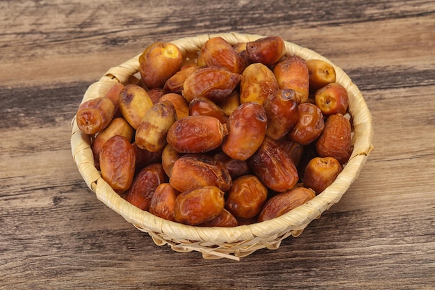 Sweet tasty dry dates in the basket