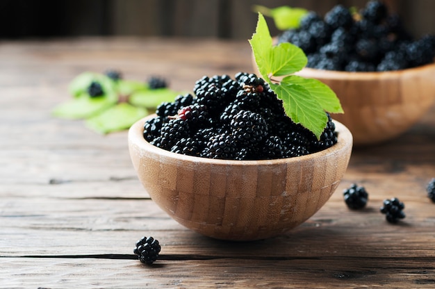 Sweet wild blackberry on the wooden table