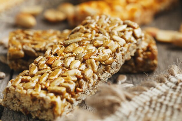 Sweets Bar of sunflower seeds. Delicious oriental sweets Gozinaki from sunflower seeds, sesame and peanuts, covered with honey with a shiny icing