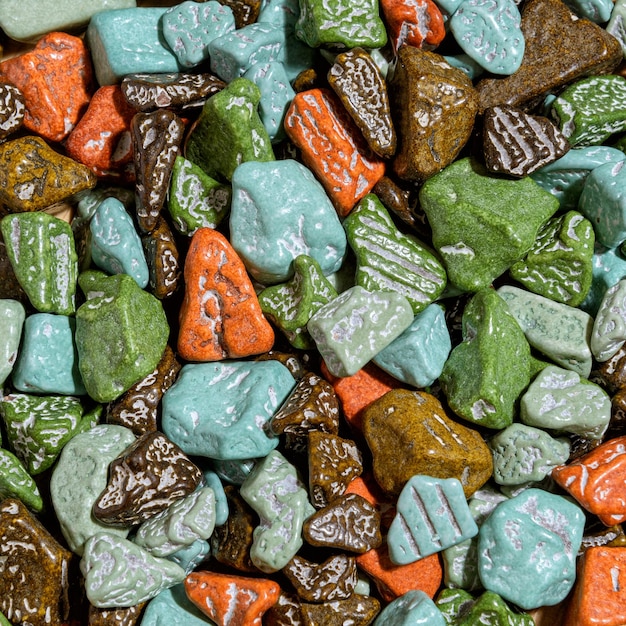 Sweets in the form of multicolored stones background