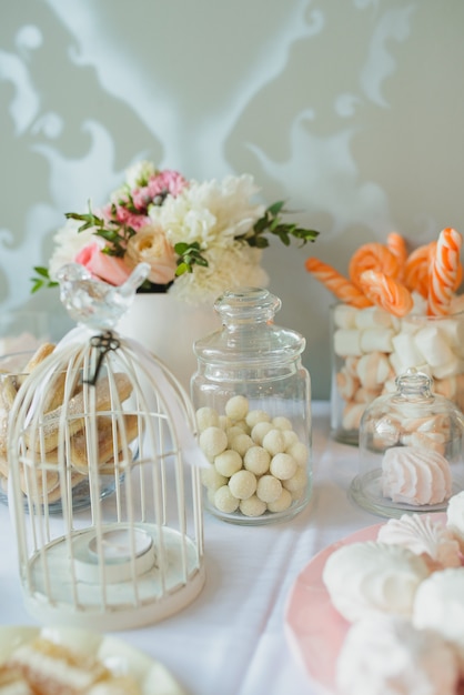 Sweets, nuts in sugar, marshmallows, meringue - candy bar at the wedding. Decor, sweet table