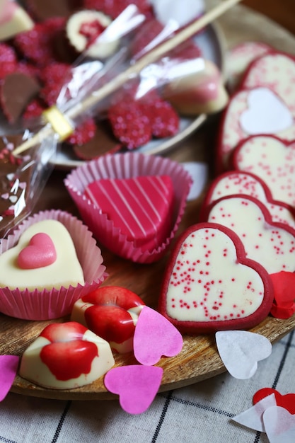 Sweets for Valentine's Day Chocolates and cookies in the form of hearts