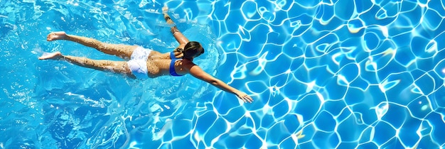 Swimmer diving into a pool