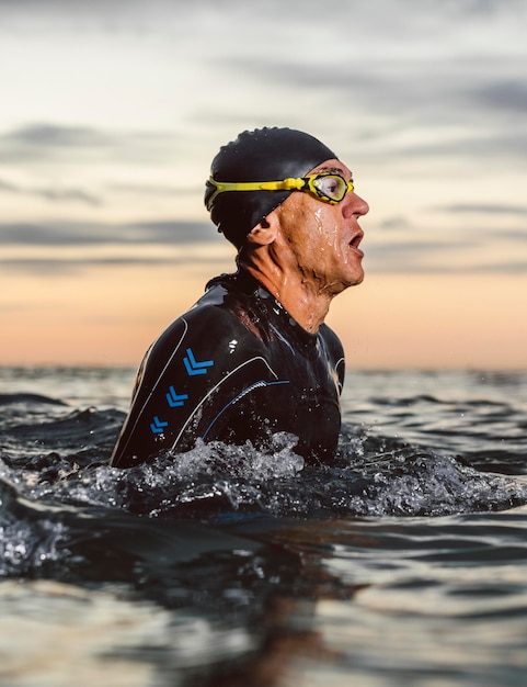 Swimmer wearing equipment in water