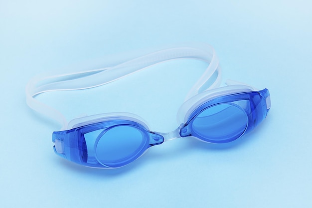 Swimming goggles on a blue background sports summer leisure